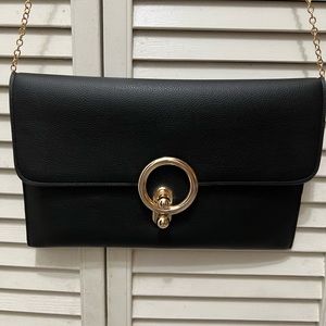 Black leather purse with gold button
